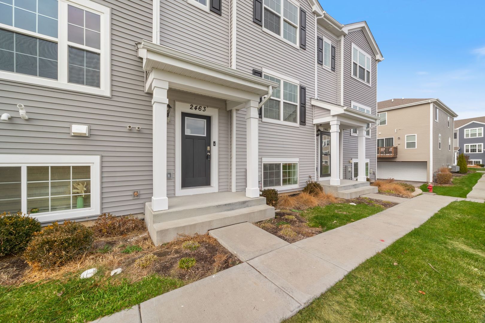 2463 BELLA Drive Pingree Grove, IL 60140 - Photo 2 of 24 a front view of a house with a yard