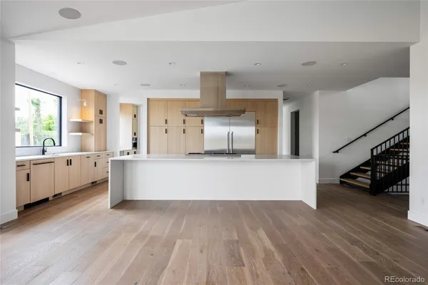 a kitchen with stainless steel appliances a sink and a stove