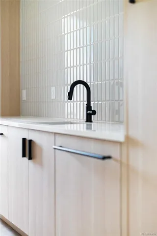 a bathroom with a sink and a window