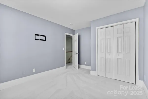 an empty room with closet area