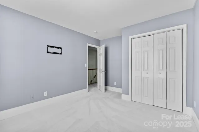 an empty room with closet area