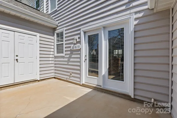 a view of front door and garage