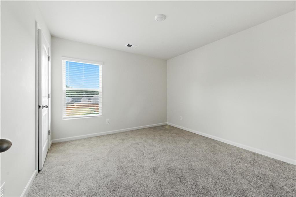 6753 Chilkat Court Southwest Atlanta, GA 30331 - Photo 11 of 16 an empty room with a window