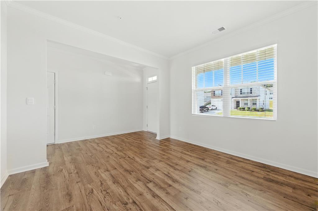 6753 Chilkat Court Southwest Atlanta, GA 30331 - Photo 13 of 16 a view of an empty room with wooden floor and a window