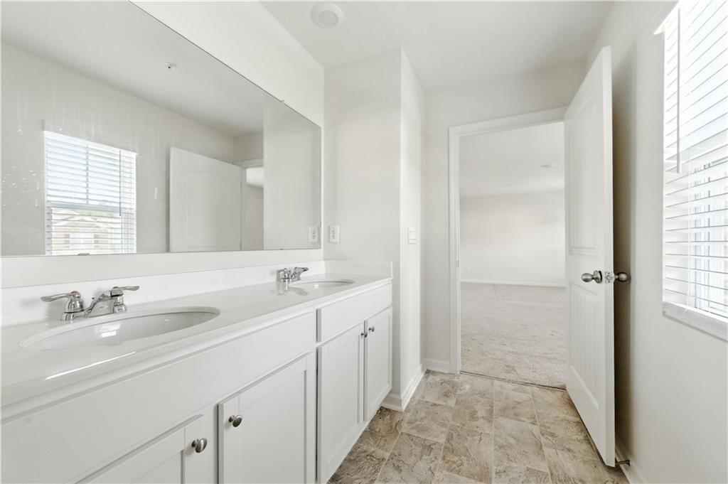 6753 Chilkat Court Southwest Atlanta, GA 30331 - Photo 14 of 16 a bathroom with a sink and a mirror