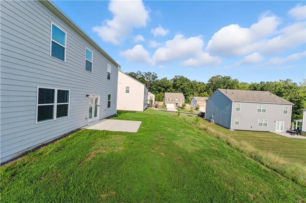 6753 Chilkat Court Southwest Atlanta, GA 30331 - Photo 16 of 16 a view of a house with a yard