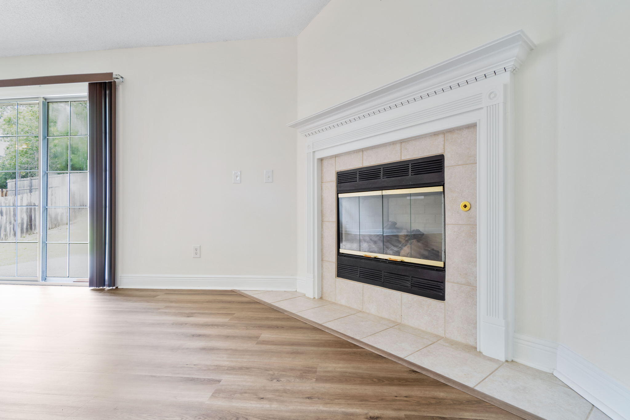 641 Territory Lane Crestview, FL 32536 - Photo 11 of 41 a view of an empty room with wooden floor and a window