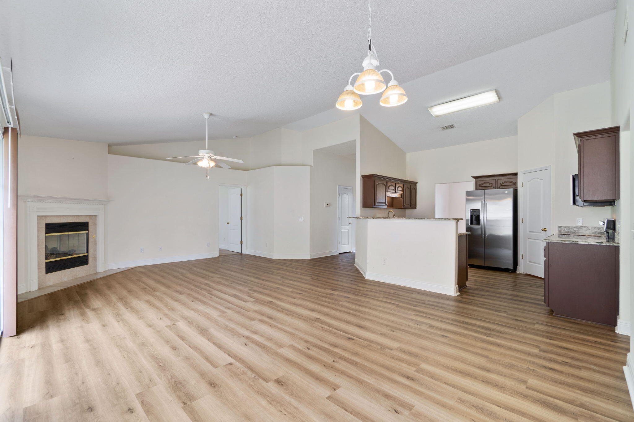 641 Territory Lane Crestview, FL 32536 - Photo 13 of 41 a view of a kitchen with microwave and cabinets