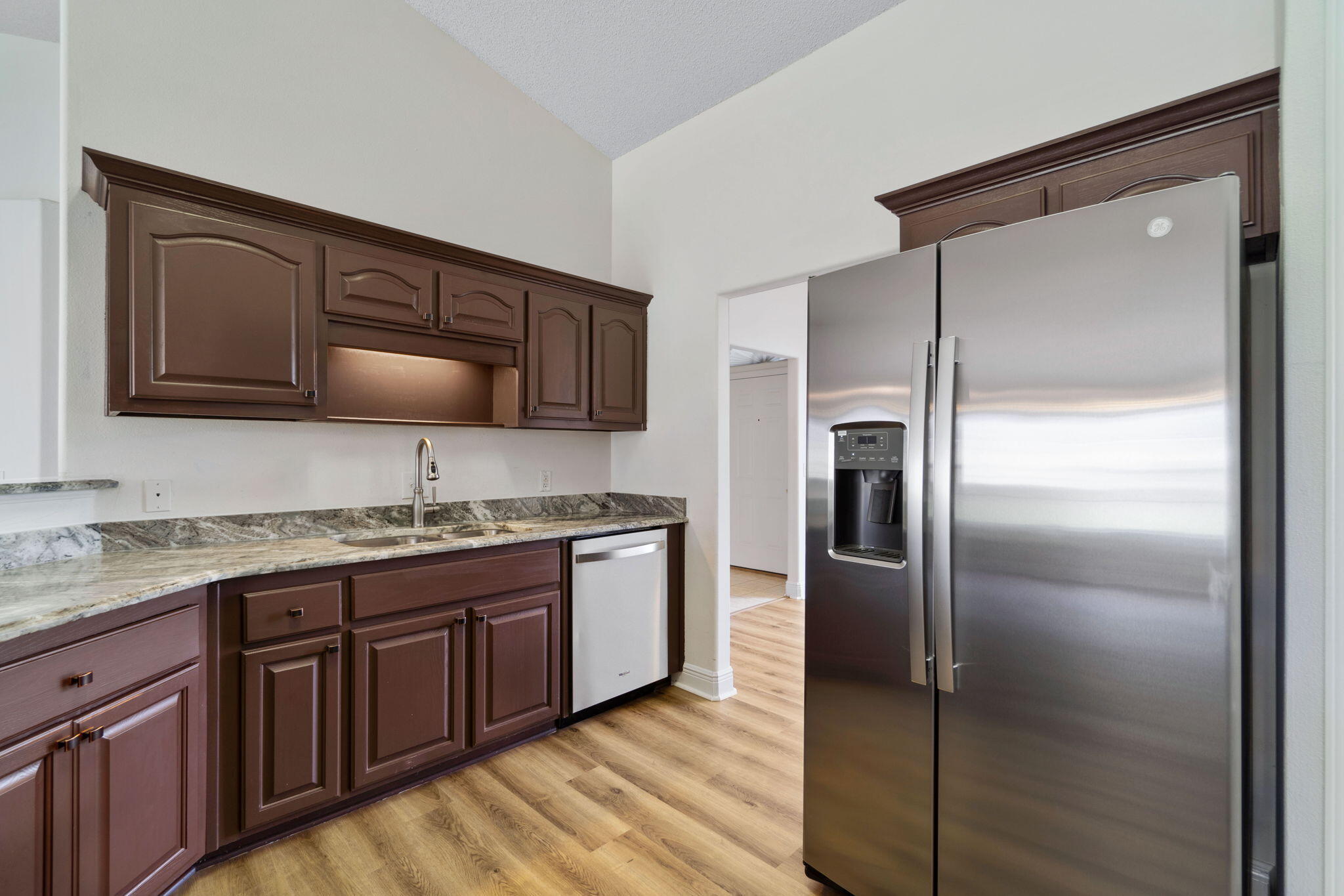 641 Territory Lane Crestview, FL 32536 - Photo 16 of 41 a kitchen with stainless steel appliances granite countertop a refrigerator and a stove top oven