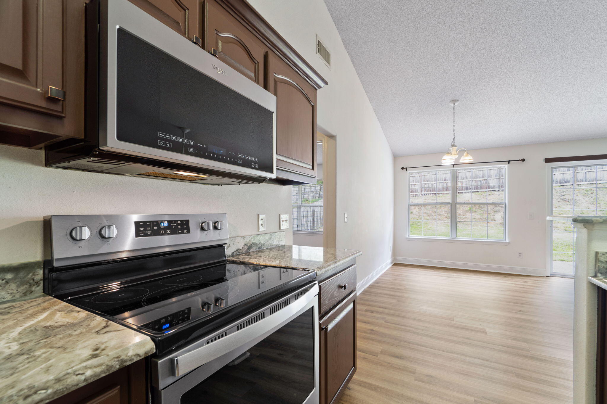 641 Territory Lane Crestview, FL 32536 - Photo 18 of 41 a kitchen with a stove and a microwave