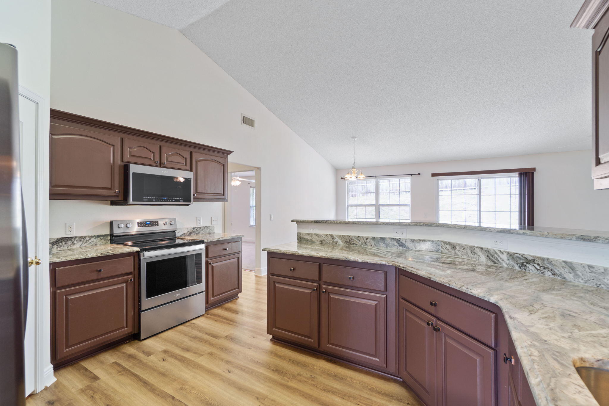 641 Territory Lane Crestview, FL 32536 - Photo 19 of 41 a kitchen with granite countertop cabinets stainless steel appliances and a counter space