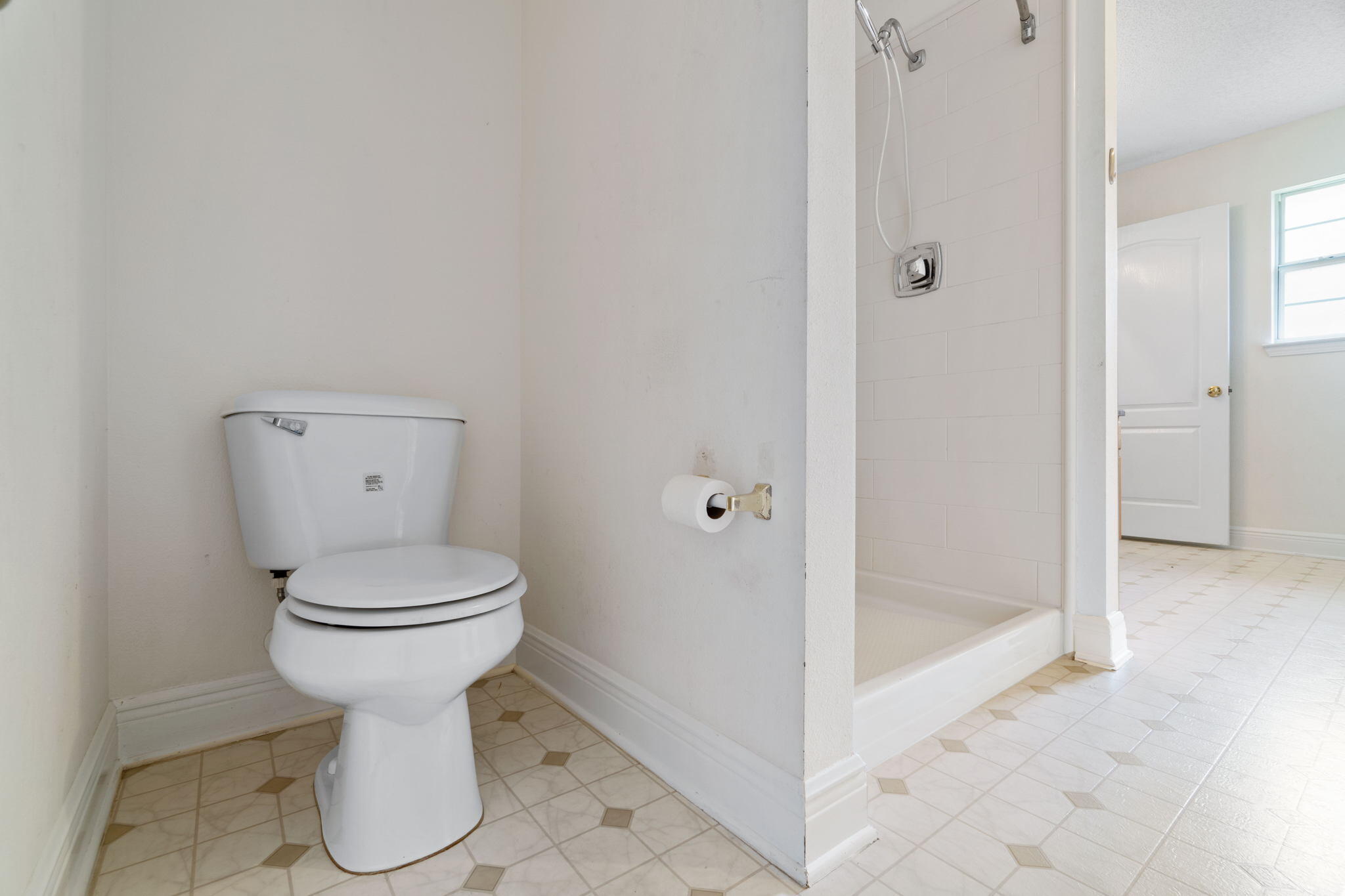 641 Territory Lane Crestview, FL 32536 - Photo 25 of 41 a bathroom with a toilet and a shower