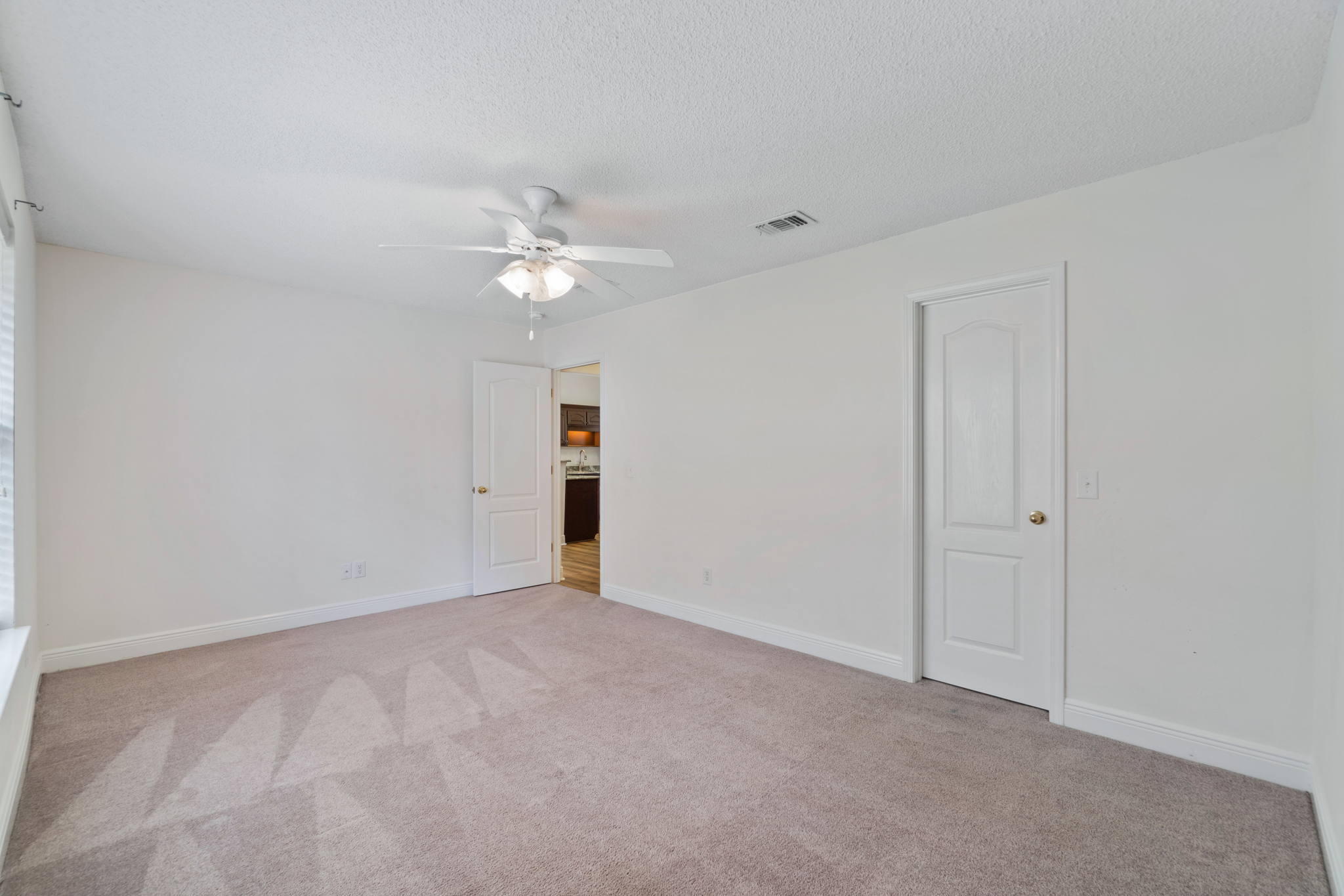 641 Territory Lane Crestview, FL 32536 - Photo 30 of 41 a view of an empty room with a ceiling fan