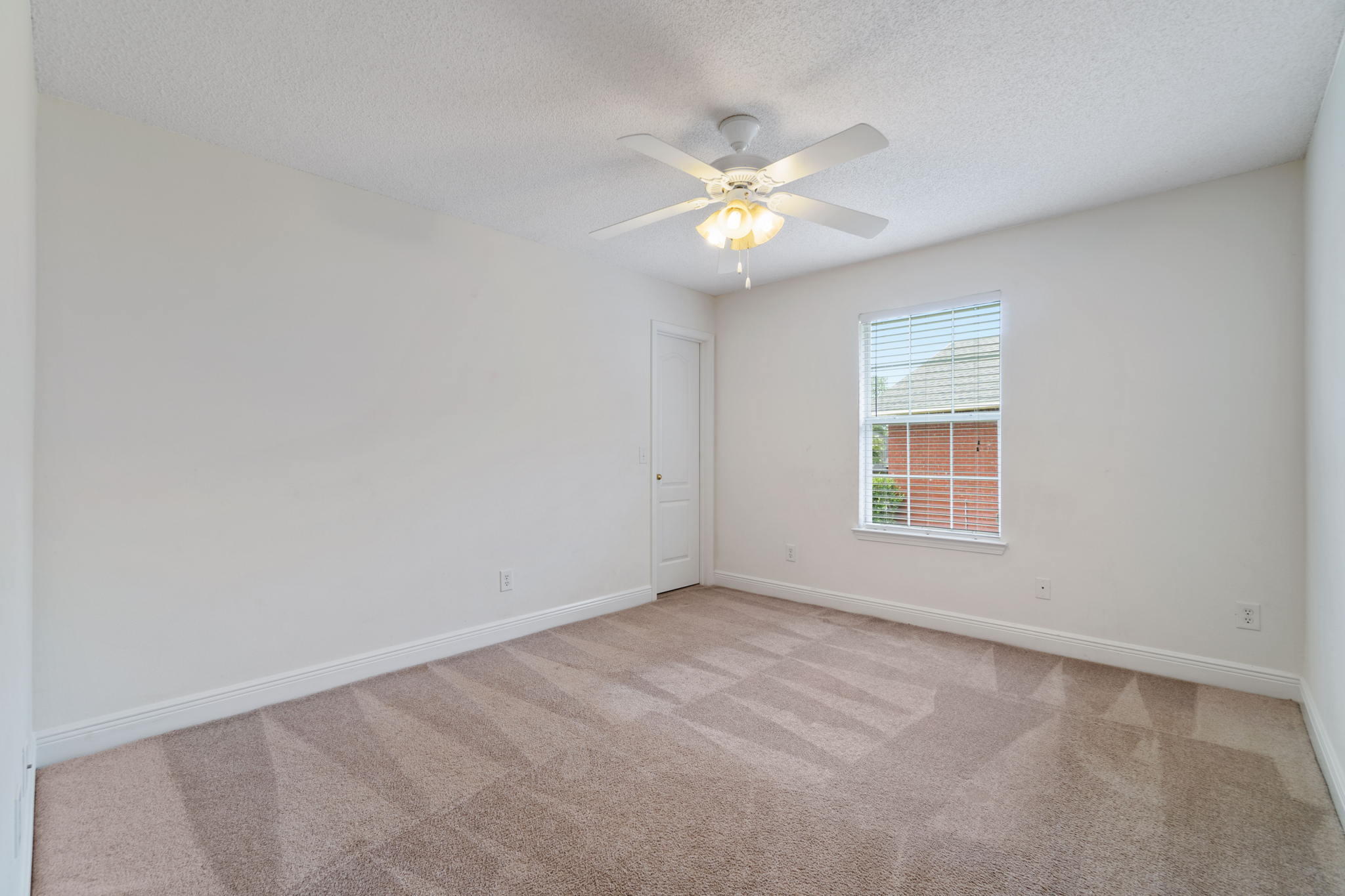 641 Territory Lane Crestview, FL 32536 - Photo 33 of 41 an empty room with windows and fan