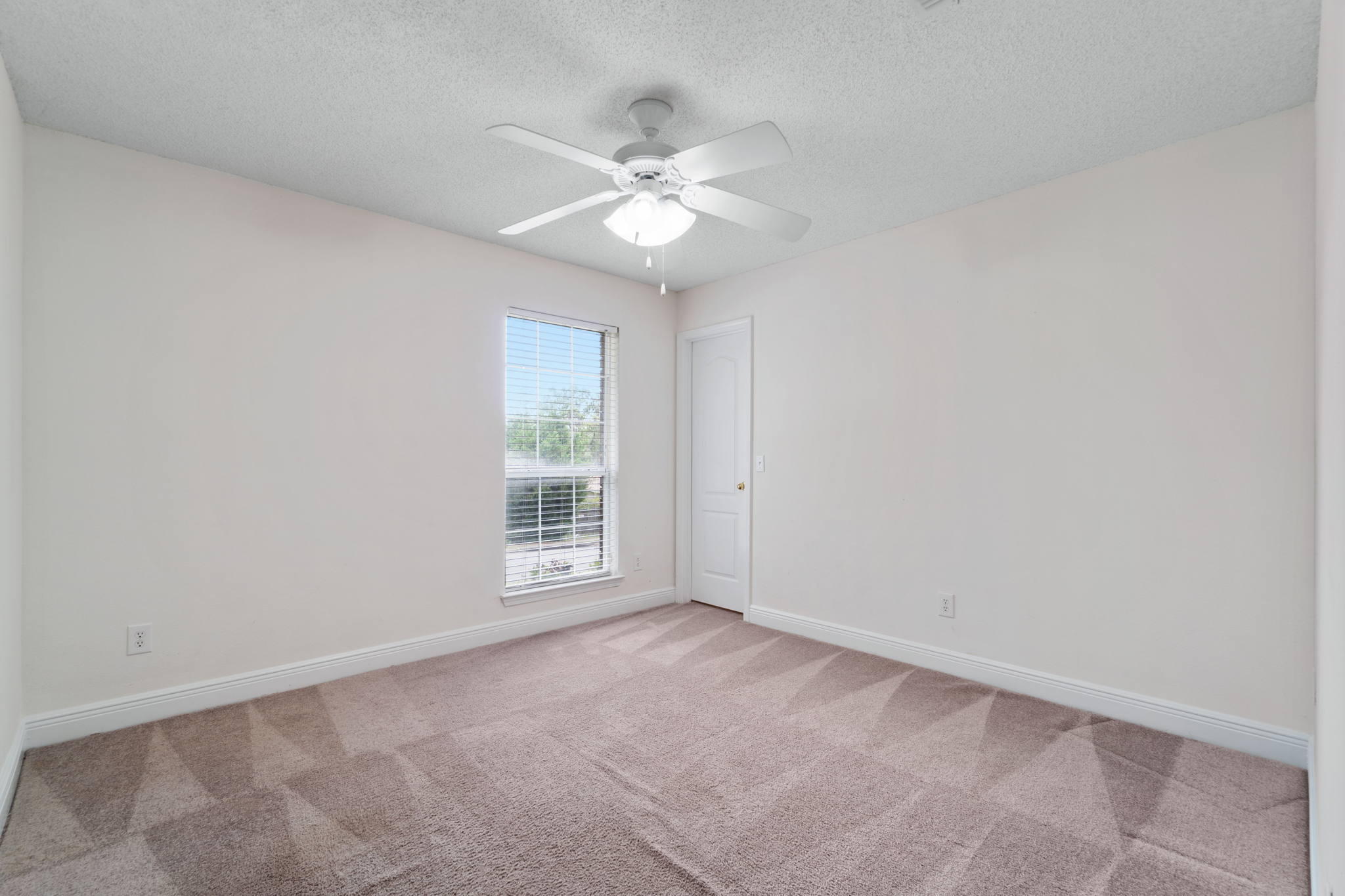 641 Territory Lane Crestview, FL 32536 - Photo 35 of 41 an empty room with a window and a fan