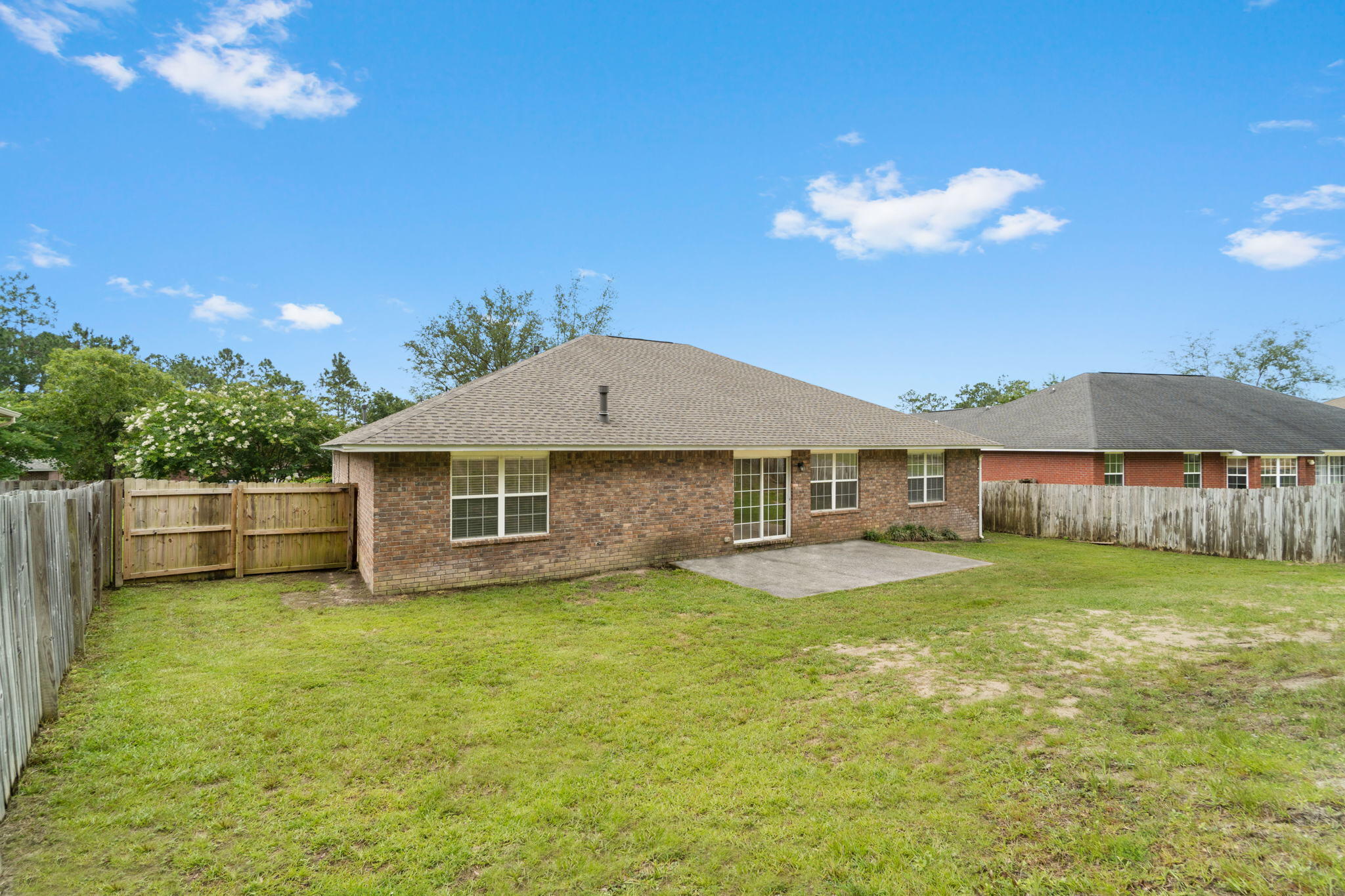 641 Territory Lane Crestview, FL 32536 - Photo 41 of 41 a view of a house with a yard and a garden