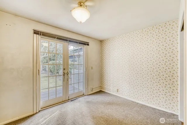 a view of an empty room with a window