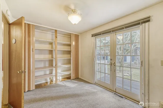 a view of an empty room with a window