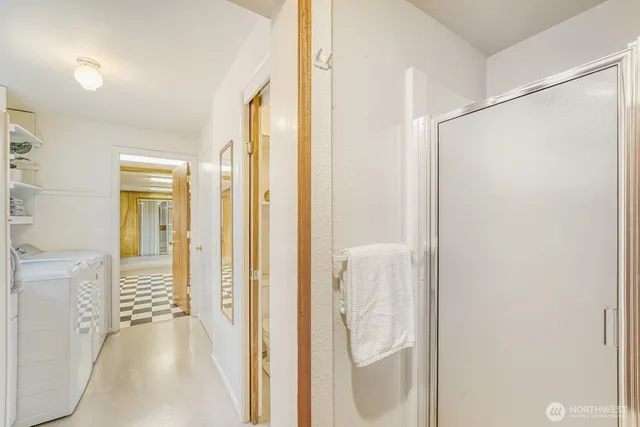 a view of a bathroom from a hallway