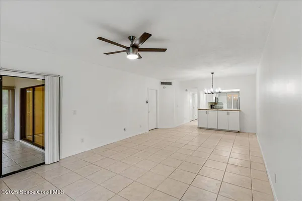 a view of empty room with windows