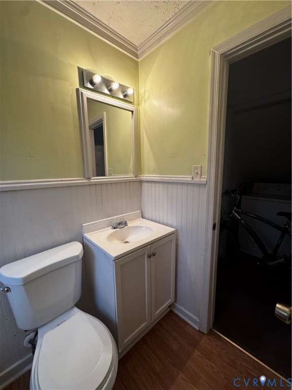 5606 Lakeside Avenue Henrico, VA 23228 - Photo 6 of 10 a bathroom with a toilet sink and mirror