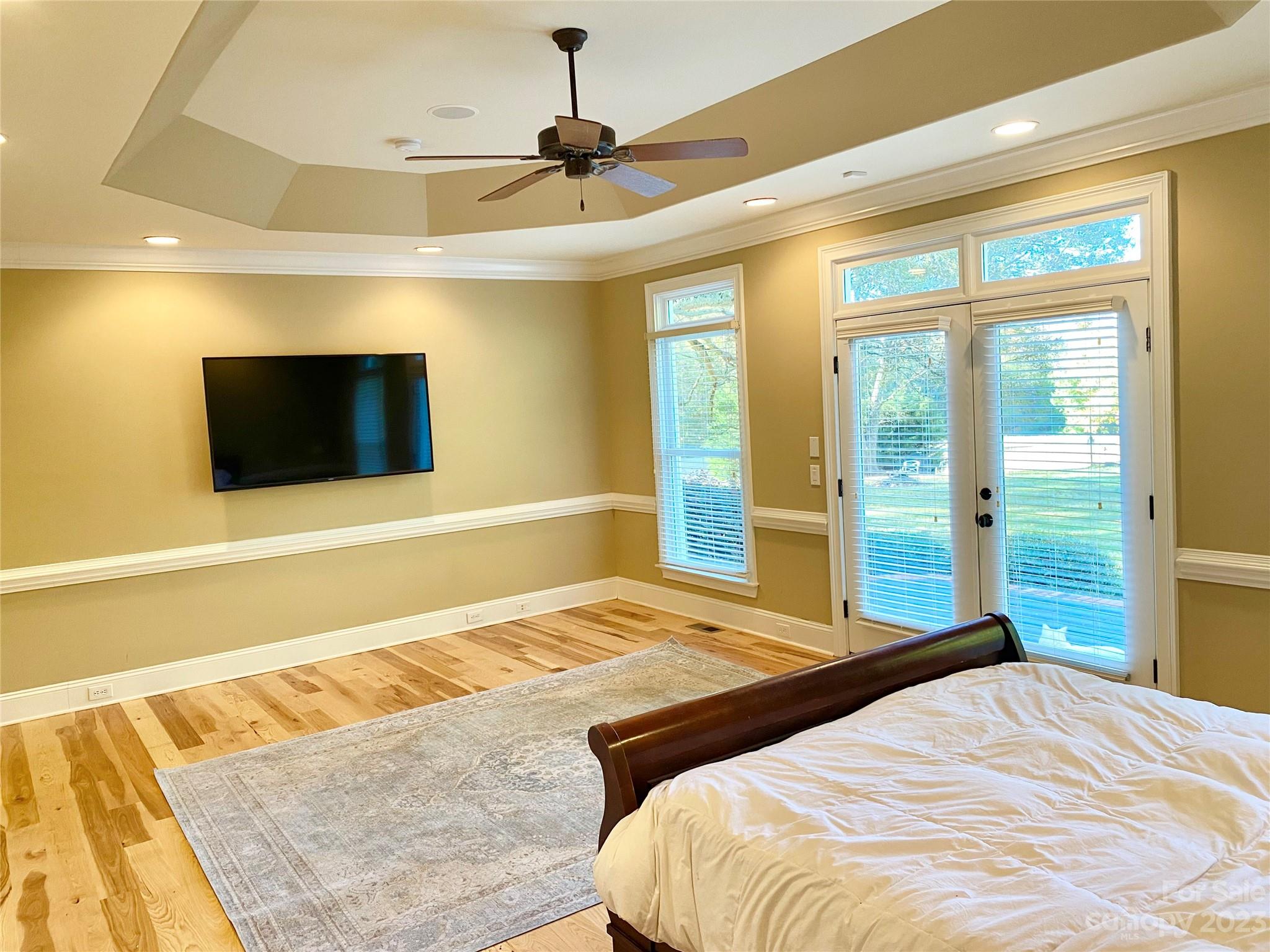 13849 Beatties Ford Road Huntersville, NC 28078 - Photo 24 of 48 a bedroom with a bed and a flat screen tv