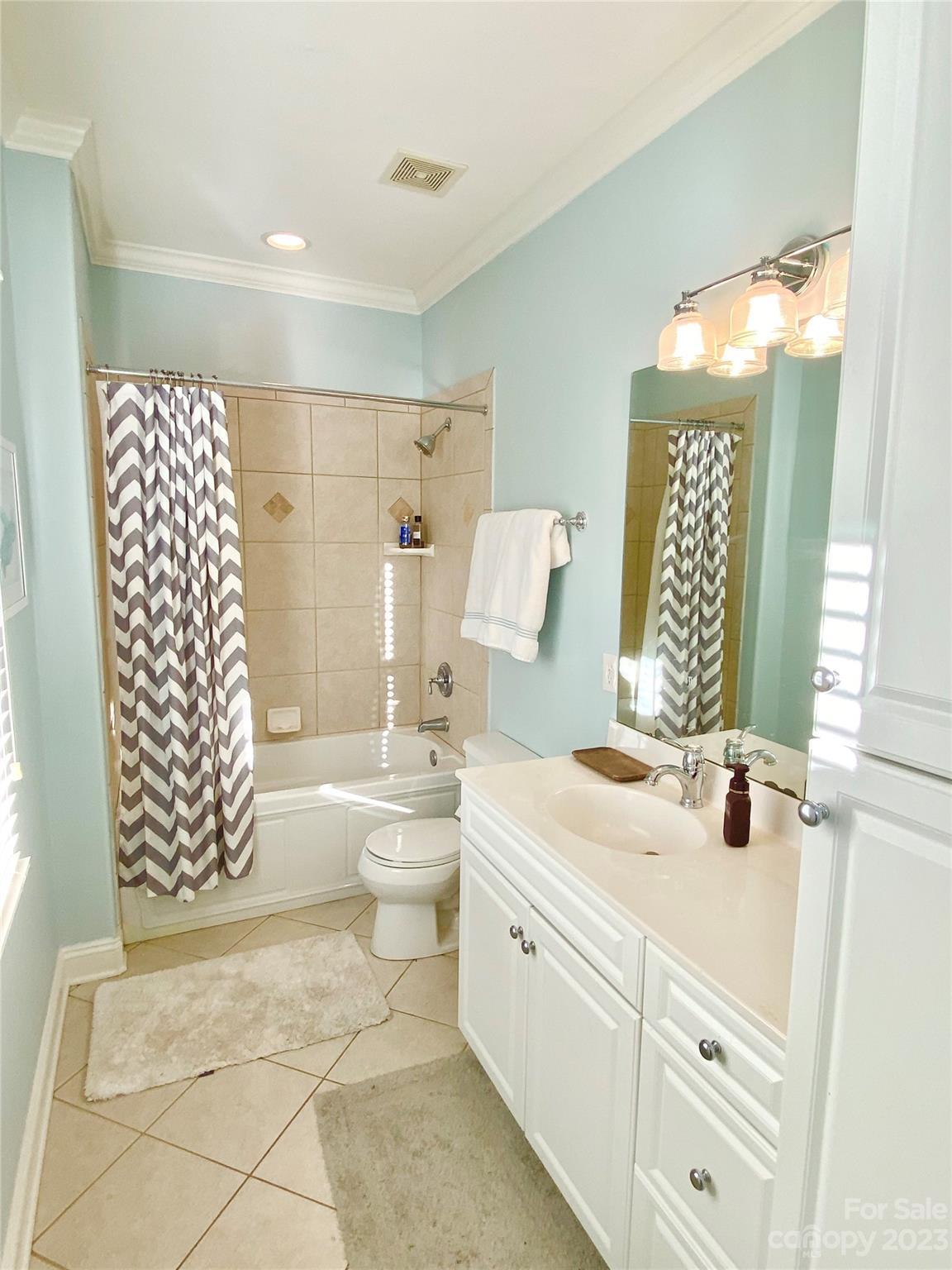 13849 Beatties Ford Road Huntersville, NC 28078 - Photo 30 of 48 a bathroom with a sink toilet and shower