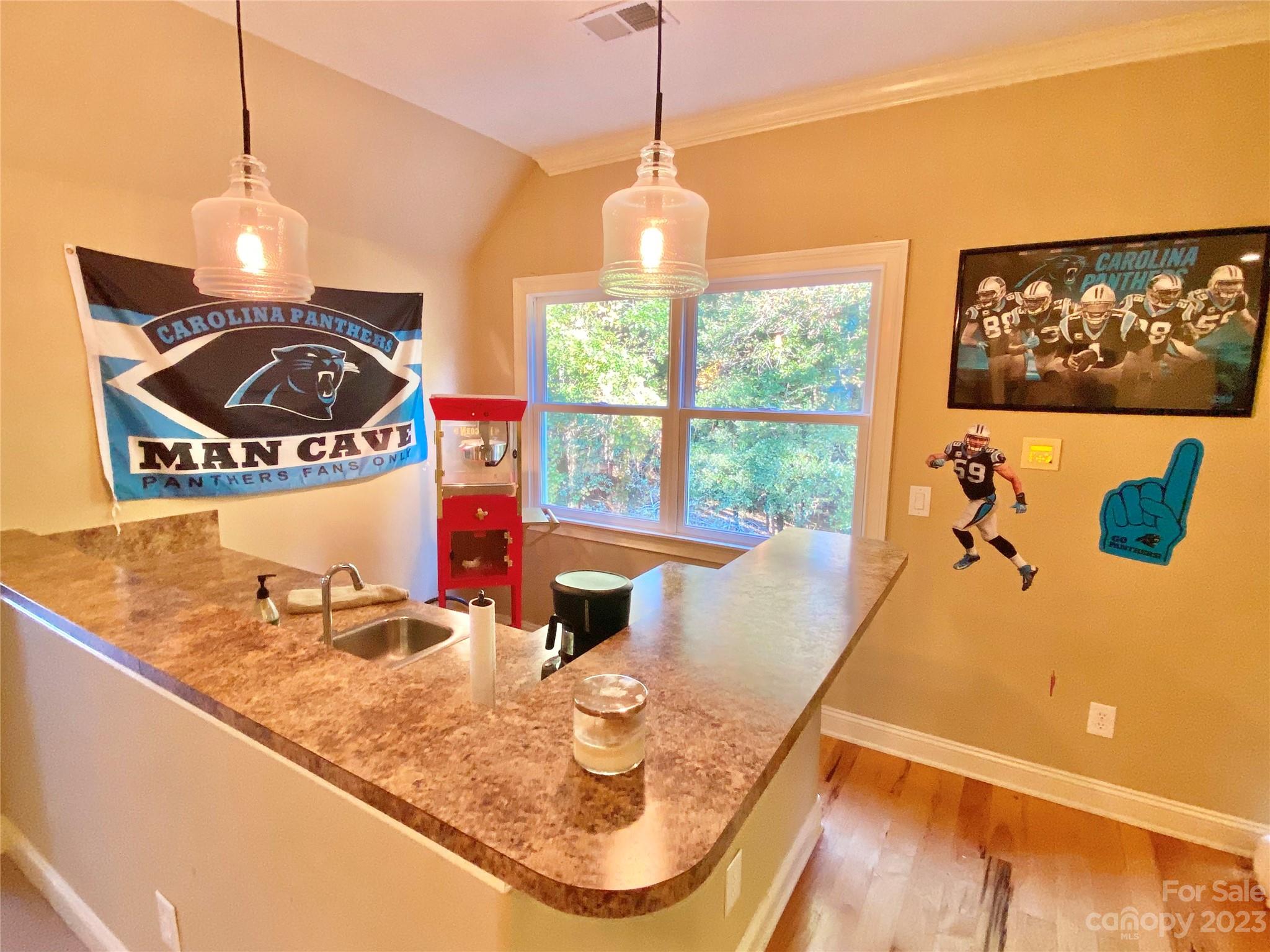 13849 Beatties Ford Road Huntersville, NC 28078 - Photo 35 of 48 a view of a dining room with furniture window and wooden floor