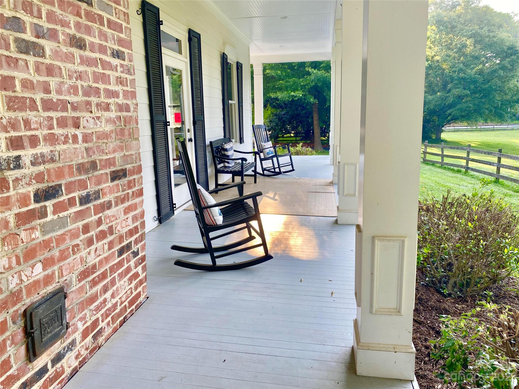 13849 Beatties Ford Road Huntersville, NC 28078 - Photo 37 of 48 a swimming pool with outdoor seating and plants