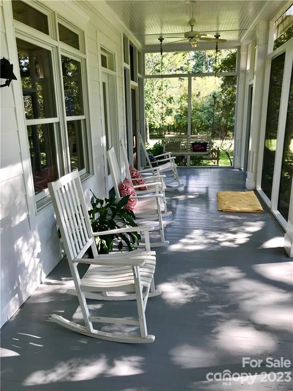 13849 Beatties Ford Road Huntersville, NC 28078 - Photo 38 of 48 a view of a porch with chairs