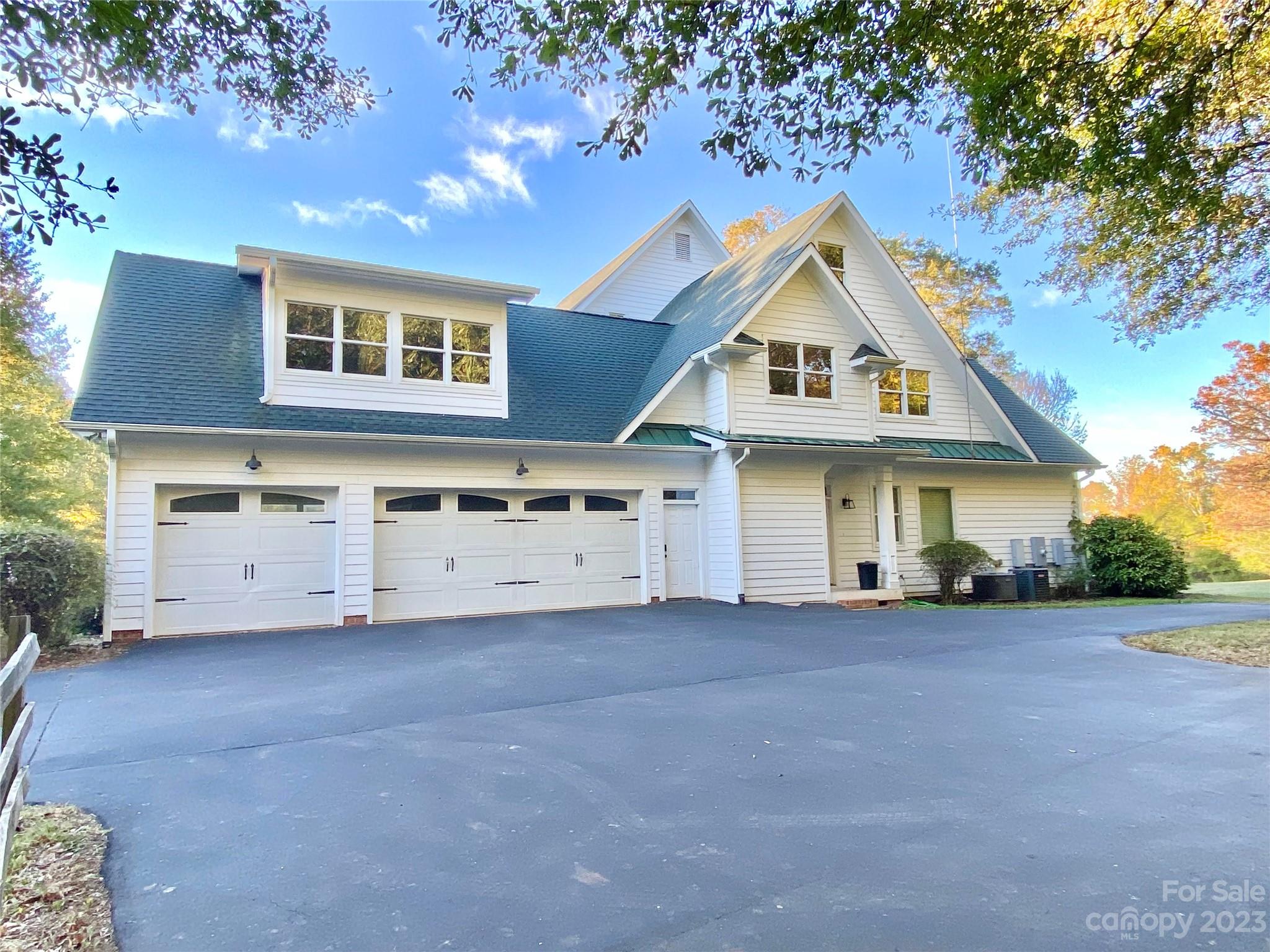 13849 Beatties Ford Road Huntersville, NC 28078 - Photo 41 of 48 a view of a house with a yard and garage