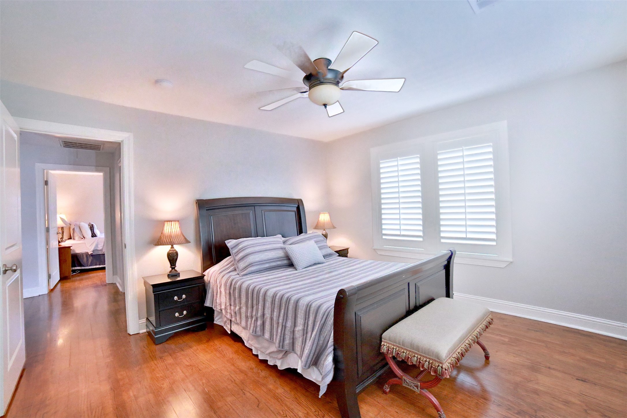 2625 Peckham Street Houston, TX 77098 - Photo 20 of 27 a bedroom with a bed and a chandelier