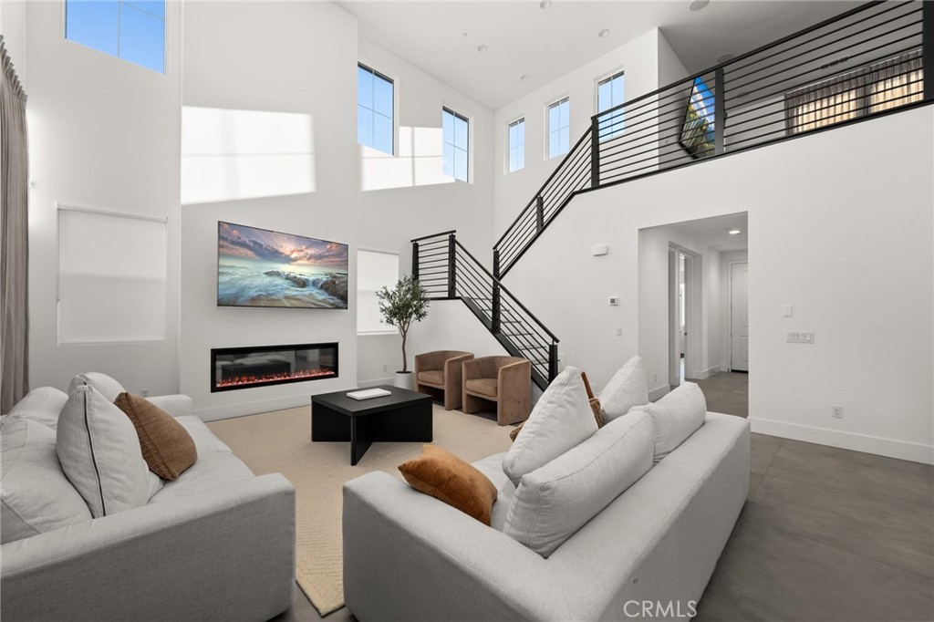 11401 West Serrano Square Yucaipa, CA 92399 - Photo 13 of 46 a living room with furniture and a flat screen tv