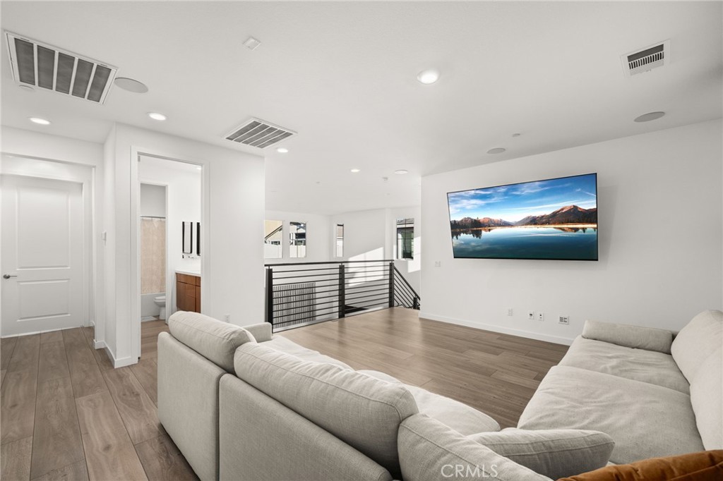 11401 West Serrano Square Yucaipa, CA 92399 - Photo 28 of 46 a living room with furniture and a flat screen tv