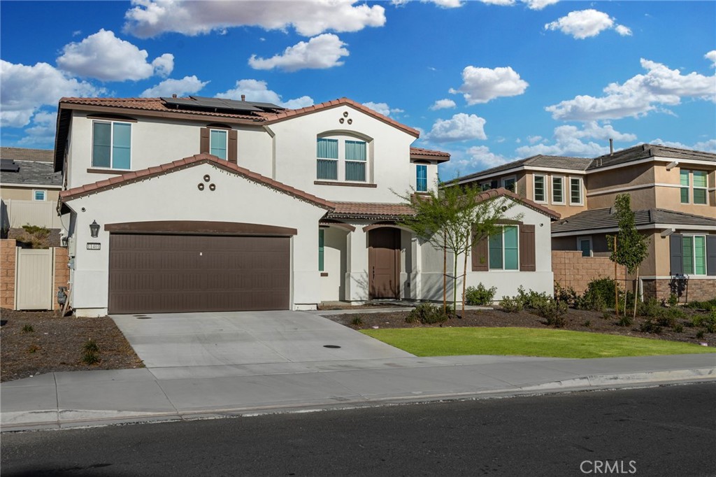 11401 West Serrano Square Yucaipa, CA 92399 - Photo 3 of 46 a front view of a house with a yard