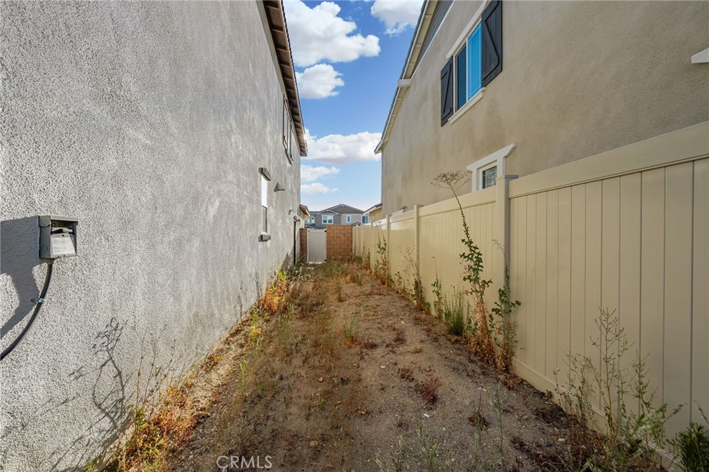 11401 West Serrano Square Yucaipa, CA 92399 - Photo 32 of 46 a view of a pathway gate of a building