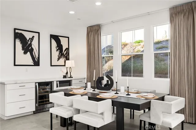 a view of a dining room with furniture and window