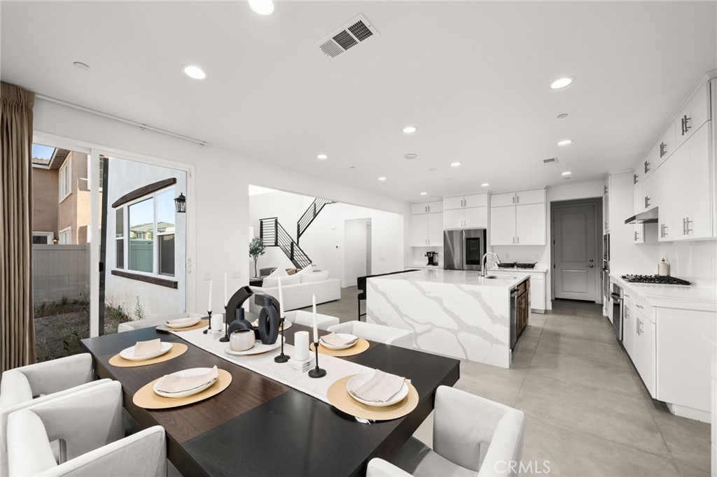 11401 West Serrano Square Yucaipa, CA 92399 - Photo 34 of 46 a living room with furniture and kitchen view