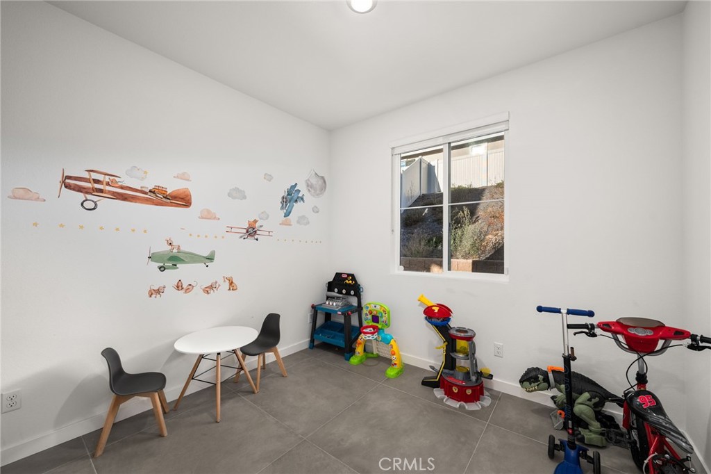 11401 West Serrano Square Yucaipa, CA 92399 - Photo 36 of 46 a children room with toys and a window