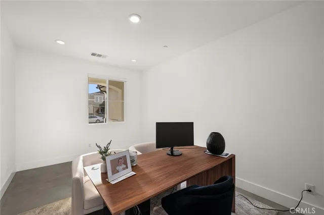 a view of a workspace with furniture