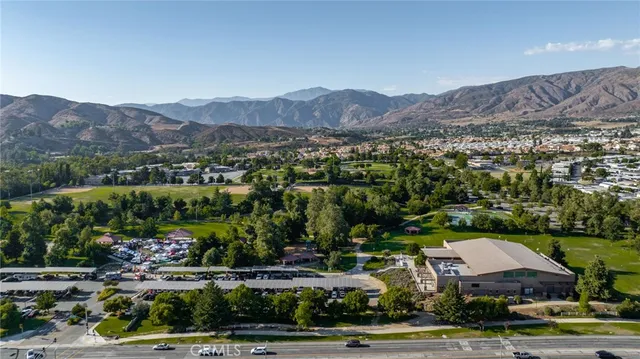 an aerial view of residential house with outdoor space and river all around