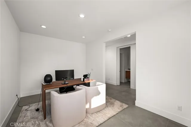 a living room with a couch and a window