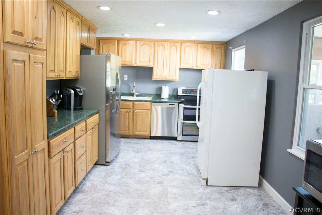 9331 Archway Road North Chesterfield, VA 23236 - Photo 3 of 15 a kitchen with stainless steel appliances granite countertop a refrigerator and a stove top oven