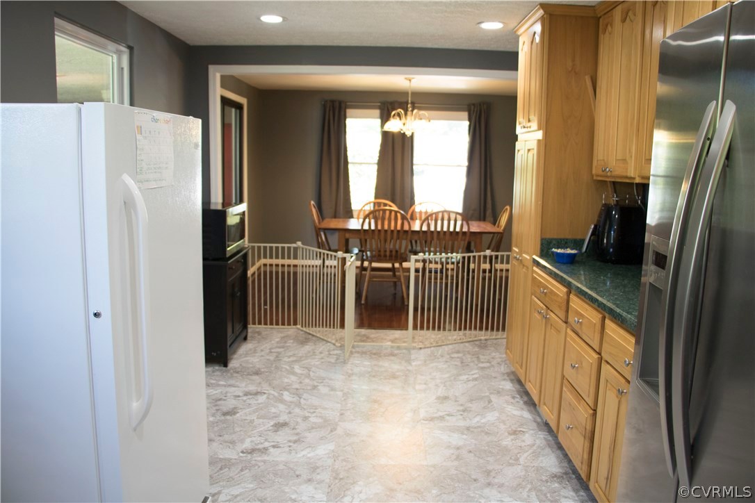 9331 Archway Road North Chesterfield, VA 23236 - Photo 4 of 15 a view of a kitchen with a refrigerator