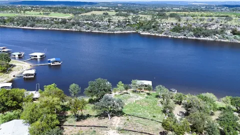 a view of a lake with a house in the background