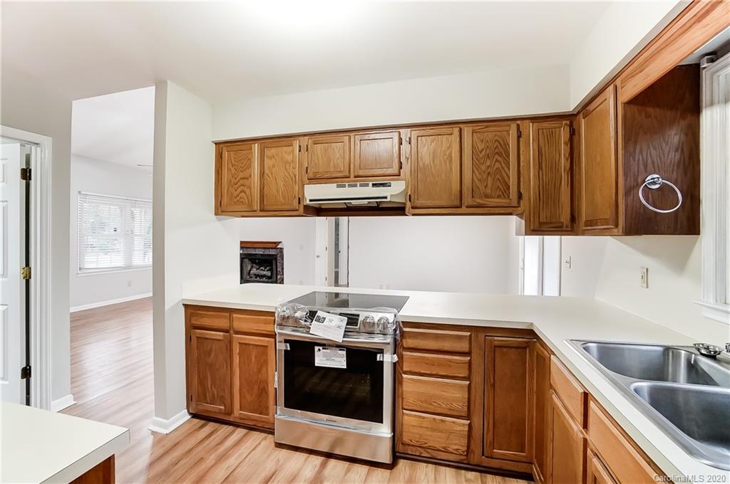 2385 Whitley Road Fort Mill, SC 29708 - Photo 8 of 25 a kitchen with stainless steel appliances granite countertop a sink stove and microwave