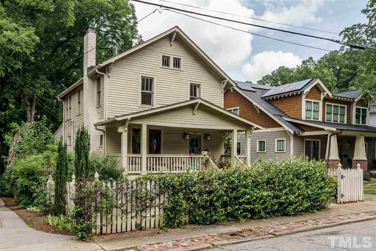121 Hudson Street Raleigh, NC 27608 - Photo 1 of 30 a view of a white house next to a yard