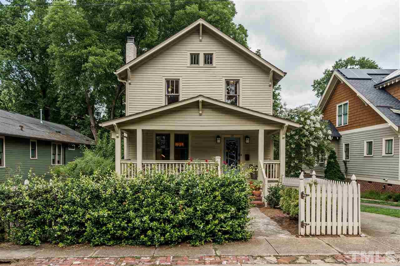 121 Hudson Street Raleigh, NC 27608 - Photo 2 of 30 a front view of a house with a yard