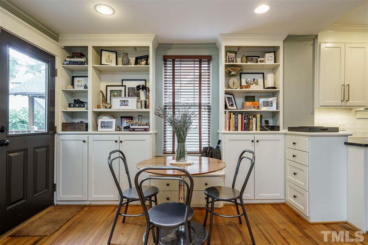 121 Hudson Street Raleigh, NC 27608 - Photo 15 of 30 a dining room with furniture and wooden floor