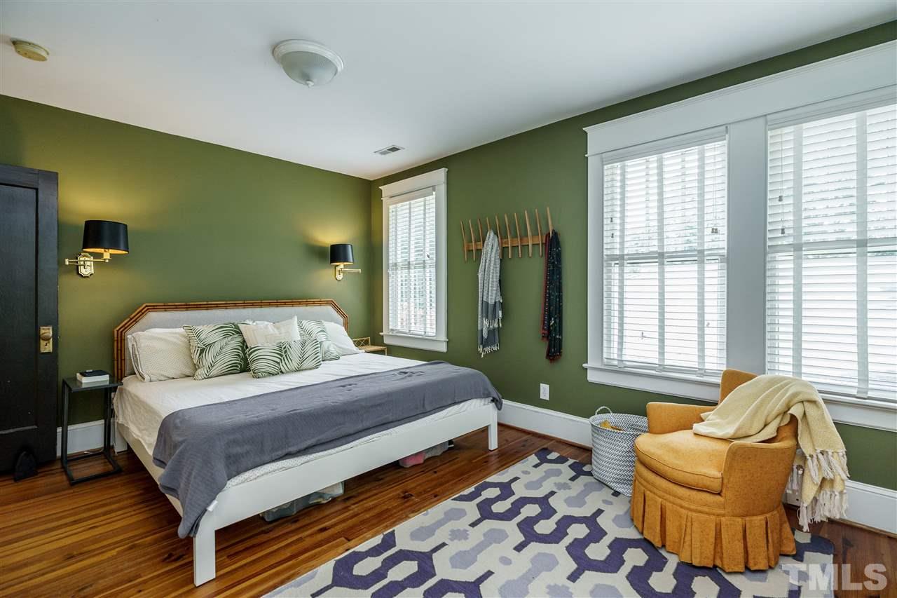 121 Hudson Street Raleigh, NC 27608 - Photo 22 of 30 a bedroom with a bed and a couch